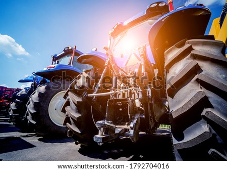Rear view of modern agricultural tractor. Industrial details.