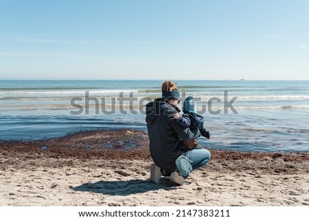 Similar – Image, Stock Photo Young woman with pipe backlit by the sea in the midnight sun