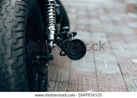 Similar – Image, Stock Photo Wheel and exhaust pipe of motorcycle on road