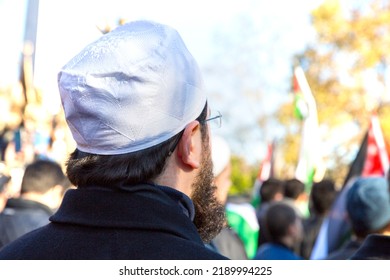 Rear View Of Muslim Man In Crowd