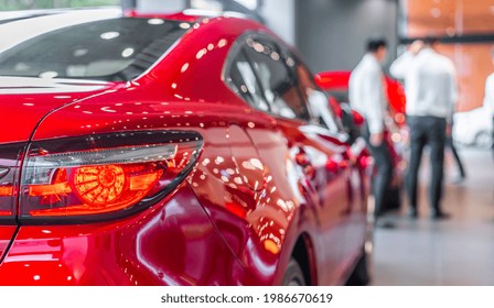 Rear View Of New Modern Red Car Led Tail Lights In Showroom