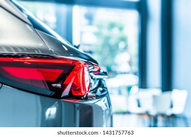 Rear View Of New Modern Silver Car Led Tail Lights In Showroom