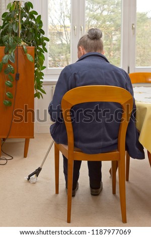 Similar – Image, Stock Photo Person with Grabber Reacher Tool