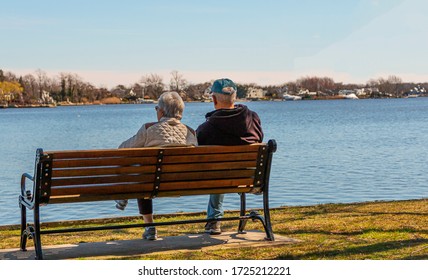 Two Guys Sitting On Beach On Stock Photo (Edit Now) 729912754