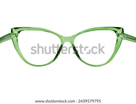 Rear view of a pair of cat eye shaped glasses with a transparent green frame isolated on a plain white background. Copy space.