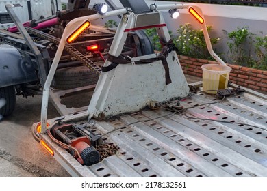 Rear View Of The Platform Of A Towing Truck. Towing Tow Light ,Turn Signal Tail,brake Lights .Roadside Assistance Concept, Fixed Contrast To Make It Darker.
