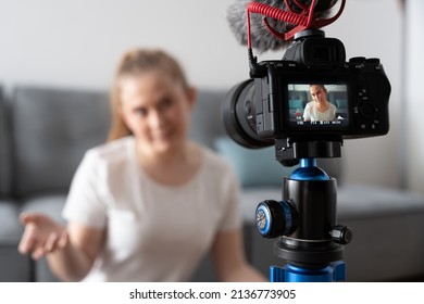 Rear view of professional slr camera recording influencer. Content creation for social media. - Powered by Shutterstock