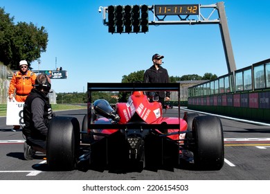 Rear View Of Racing Formula Car Standing In Racetrack Starting Grid Pole Position Driver Point Of View. Vallelunga, Italy, September 17-18 2022, Racing Weekend