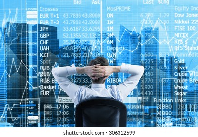 Rear View Of The Relaxing Businessman Is In A Modern Panoramic Office In Singapore. Stock Market Data On The Glass Screen.