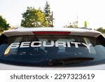 A rear view of security patrol car parked outdoors