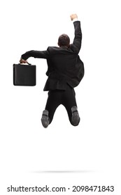 Rear view shot of a businessman with a briefcase jumping and celebrating success isolated on white background - Shutterstock ID 2098471843