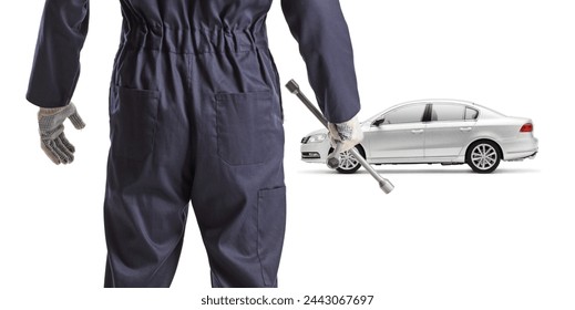 Rear view shot of a car mechanic holding a lug wrench isolated on white background - Powered by Shutterstock