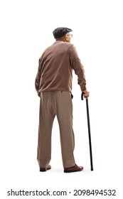 Rear view shot of an elderly man standing with a cane isolated on white background