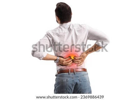 Rear view shot of a man holding lower back inflamed zone isolated on white background 