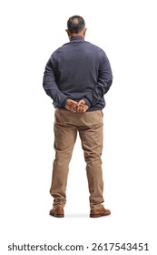 Rear view shot of a man standing with arms behind back isolated on white background