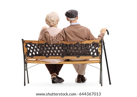 Rear view shot of a senior couple sitting on a bench isolated on white background