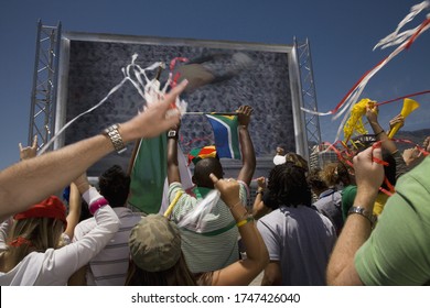 Rear View Of Sports Fans Cheering