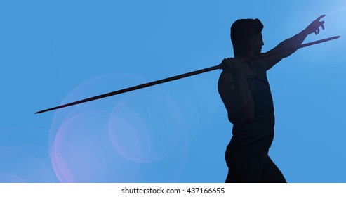 Rear view of sportsman practising javelin throw against blue background - Powered by Shutterstock