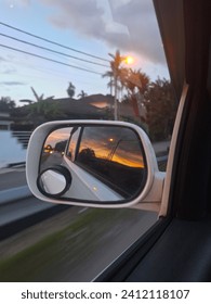 rear view sunset through sidemirror