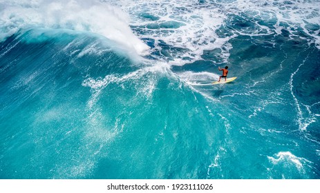 Rear View of a Surfer Riding a Fantastic Wave at Sunset Beach, Hawaii