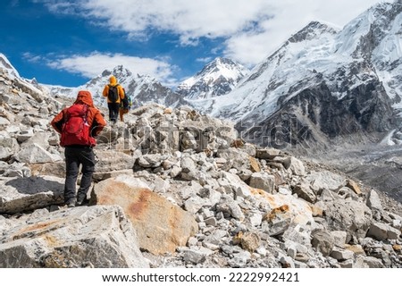 Rear view of tourist while trekking to Everest Base Camp in Nepal. Everest Base Camp Trek is undoubtedly the adventure of a lifetime and one of Nepal's best trekking destination.
