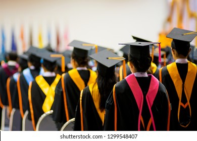 Rear View Of The University Graduates Line Up For Degree Award In University Graduation Ceremony. The University Graduates Are Gathering In The University Graduation Ceremony. Crowd Of The Graduates. 