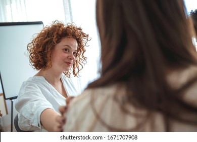 Rear View At Upset Woman Feel Pain Depression Problem Addiction Get Psychological Support Of Counselor Therapist Coach Diverse People Friend Group Help Patient During Therapy Counseling Session.