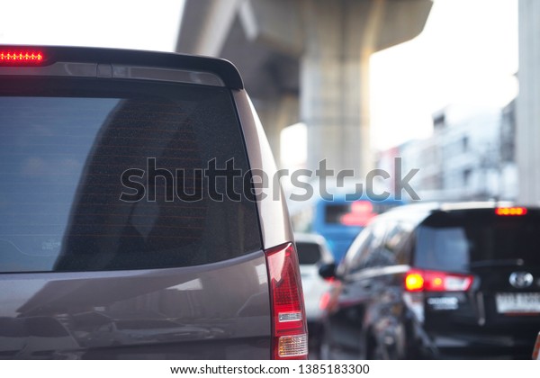 Rear view of Van for transport passengers on\
blur city background