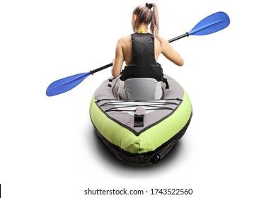 Rear view of a woman in a canoe with a life vest and a paddle isolated on white background
