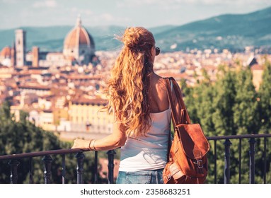 Rear view of woman looking at Florence cityscape in Italy- Firenze- tour tourism, travel destination