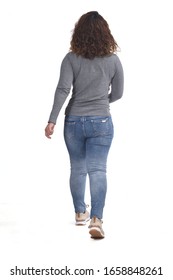 Rear View Of A Woman Walking On White