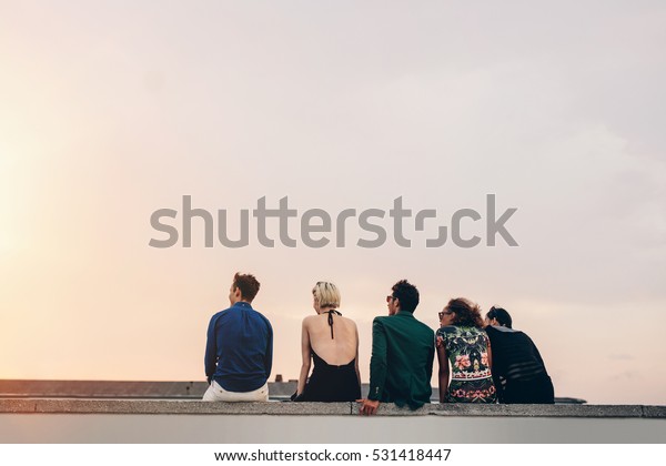 Rear View Young Friends Sitting Together Stock Photo (Edit Now) 531418447