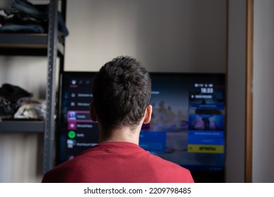 Rear View Of A Young Guy Gamer Playing Games