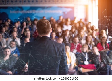 rear view of young successful businessman at business conference room with public giving presentations. Audience at the conference hall. Entrepreneurship club - Shutterstock ID 1380231950