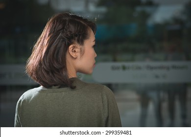 Rear View Of Young Woman With Cute Braided Hairstyle On Short Hair