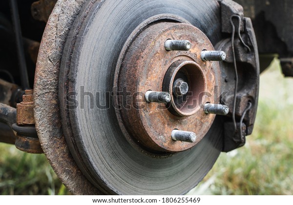 Rear wheel car suspension. Brake disc and wheel hub
of a car. Stock photo