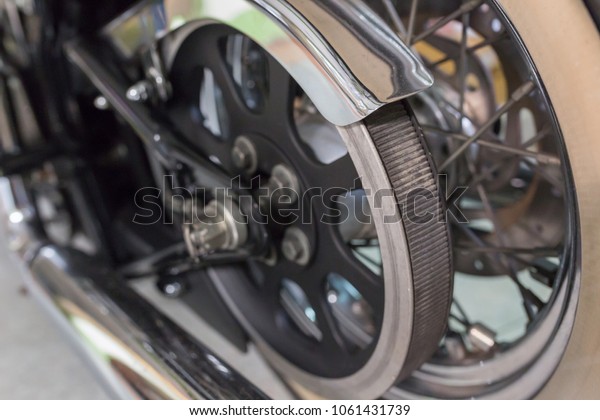 rear\
wheel of motorcycle with belt transmission\
rotation