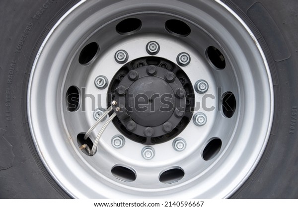 The rear wheels of a clean truck with\
new tires. Radial tubeless tires. Trucking\
concept.