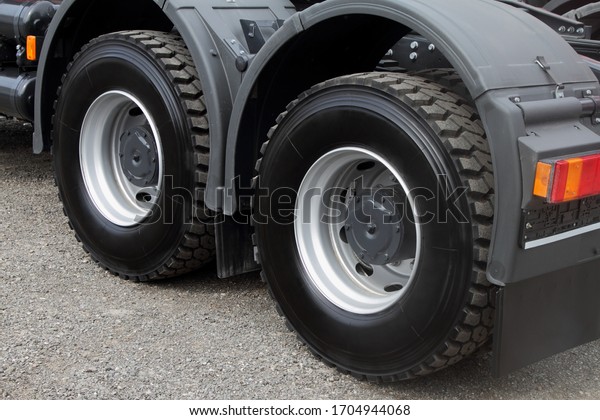 Rear wheels of a\
modern truck close-up.
