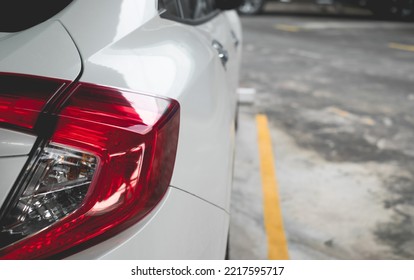 Rear white car in parking cars. Orderliness parked inside the line. - Shutterstock ID 2217595717