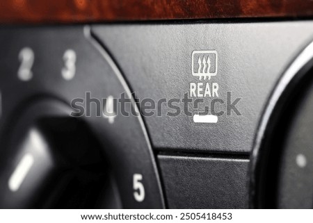 rear window heating  switch inside a used car	