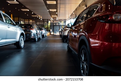 Rearview car parked in luxury showroom. Car dealership office. New car parked in modern showroom. Car for sale and rent business concept. Automobile leasing and insurance concept. Electric automobile. - Shutterstock ID 2072153708