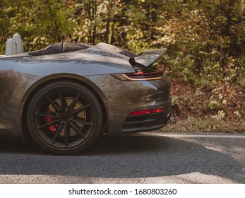 Rearview of a car where you can see its wheel, spoiler and seats. - Shutterstock ID 1680803260