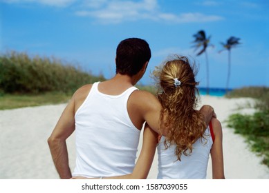 Rearview, Couple Walking Arm-in-arm Down The Beach, Cuba