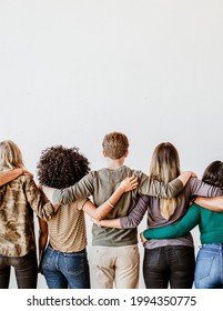 Rearview of diverse people hugging each other - Shutterstock ID 1994350775