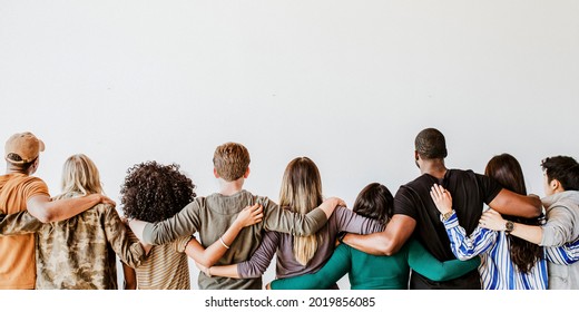 Rearview of diverse people hugging each other - Shutterstock ID 2019856085