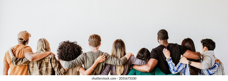 Rearview of diverse people hugging each other - Shutterstock ID 2031673100