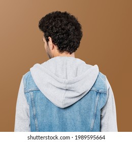 Rearview of man in a half denim hoodie jacket mockup