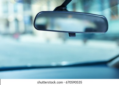 Rear-view mirror adjusted to the windshield - Shutterstock ID 670590535