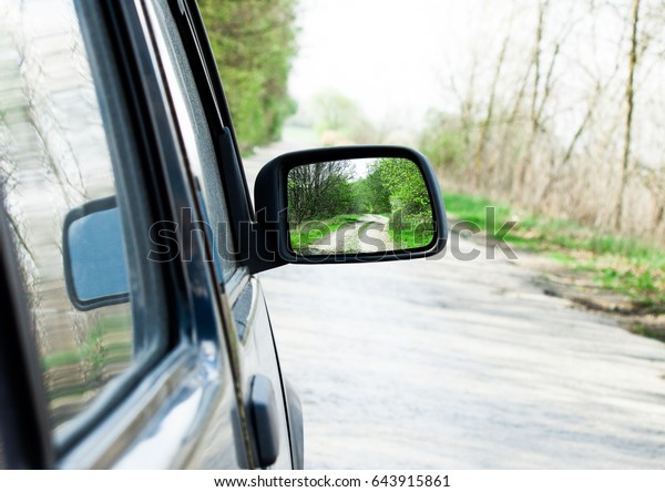 Rearview mirror\
close up on nature.\
Landscape